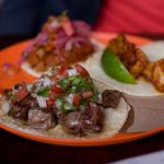Trio of tacos: carne asada, camaron al chipotle, and carnitas